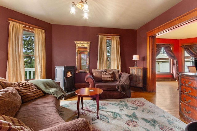 2730 Chestnut Dr, Plover, WI 54467 - living room with plenty of natural light, wood finished floors, and a chandelier