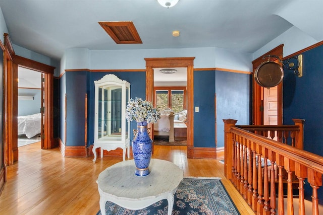 2730 Chestnut Dr, Plover, WI 54467 - hall with light wood-type flooring, baseboards, and an upstairs landing
