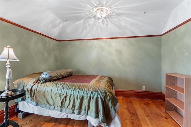 2730 Chestnut Dr, Plover, WI 54467 - bedroom featuring hardwood / wood-style floors, baseboards, ornamental molding, and lofted ceiling