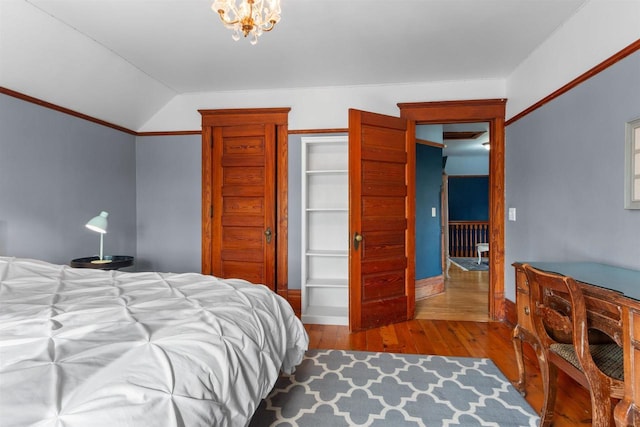 2730 Chestnut Dr, Plover, WI 54467 - bedroom featuring hardwood / wood-style flooring and vaulted ceiling