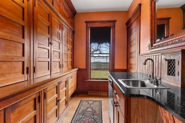 2730 Chestnut Dr, Plover, WI 54467 - kitchen featuring a sink, wainscoting, dishwasher, light wood finished floors, and brown cabinetry
