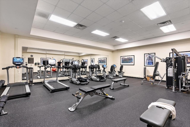 gym featuring a drop ceiling