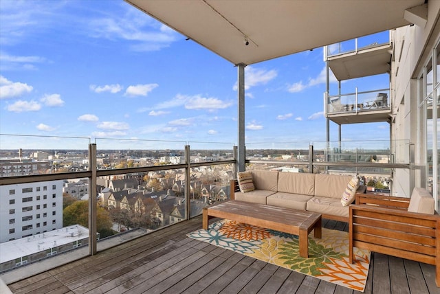 wooden deck featuring outdoor lounge area