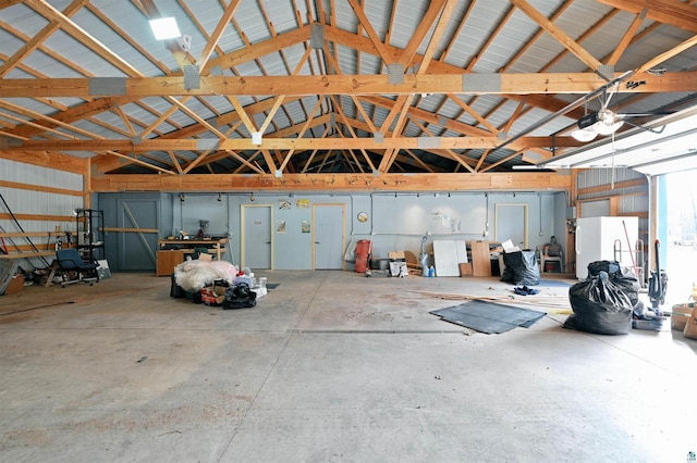 garage featuring a garage door opener and white refrigerator