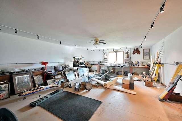 11242 S Pierce Rd, Solon Springs, WI 54873 - misc room with track lighting, finished concrete flooring, a workshop area, and ceiling fan