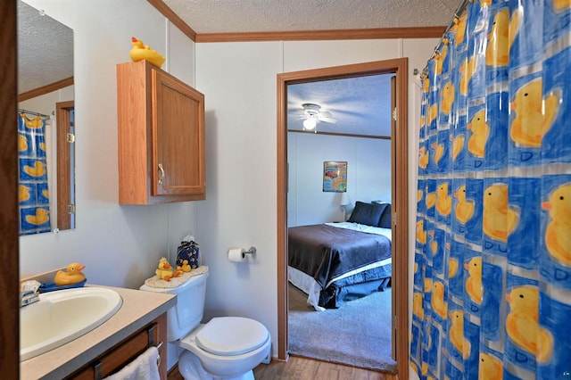 bathroom featuring a textured ceiling, wood-type flooring, lofted ceiling, and crown molding