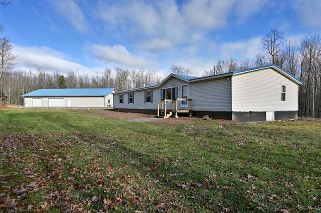 back of property featuring a lawn