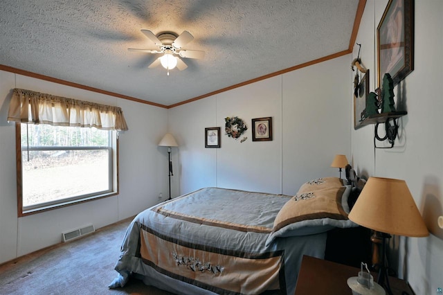 bedroom featuring carpet flooring, ceiling fan, crown molding, and a textured ceiling