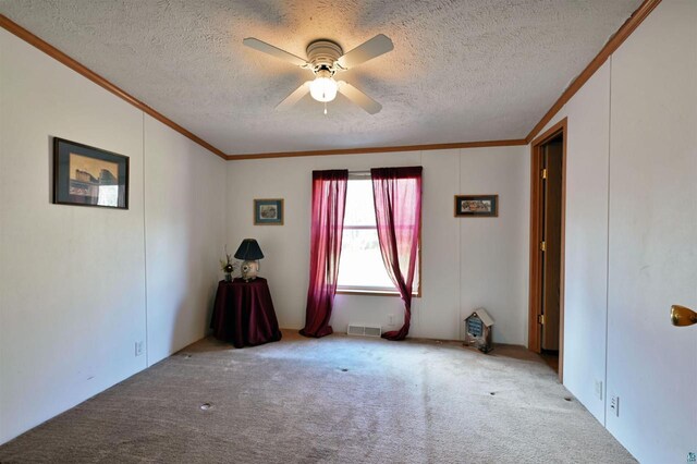 11242 S Pierce Rd, Solon Springs, WI 54873 - carpeted bedroom featuring crown molding, multiple windows, a textured ceiling, and a ceiling fan