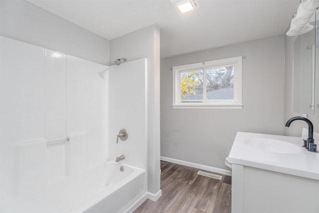 full bathroom with vanity, shower / bathtub combination, toilet, and wood-type flooring