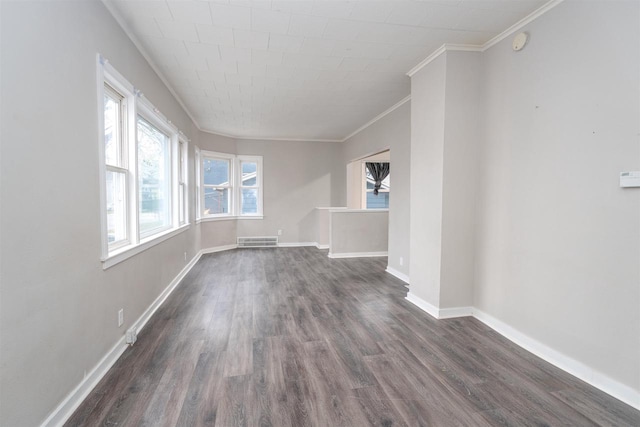 unfurnished living room with ornamental molding and dark wood-type flooring