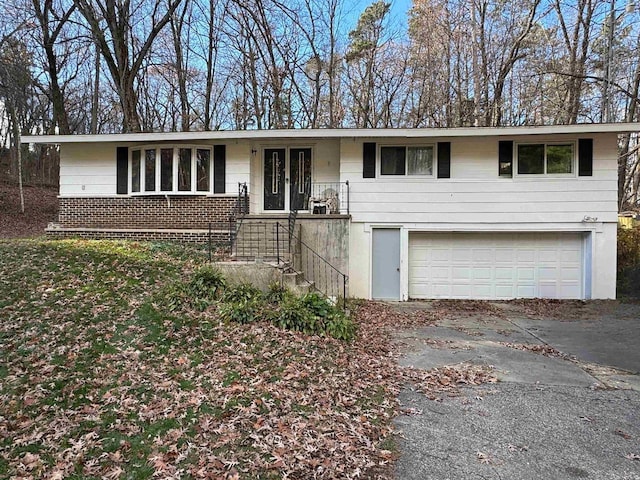 single story home featuring a garage