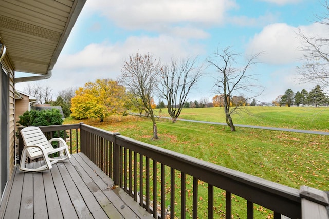 wooden deck with a lawn