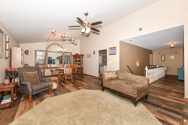 living room featuring lofted ceiling, wood finished floors, and visible vents