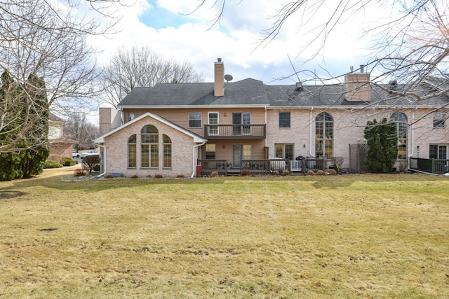 back of house featuring a lawn and a chimney