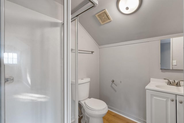 bathroom with hardwood / wood-style flooring, vanity, toilet, and an enclosed shower