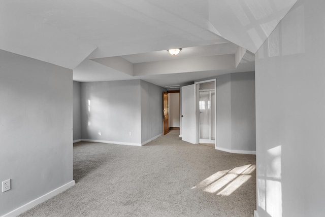 unfurnished room featuring light colored carpet