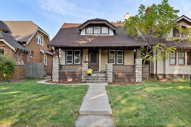 view of front of home featuring a front lawn and a porch