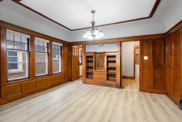 interior space with a notable chandelier and light hardwood / wood-style floors