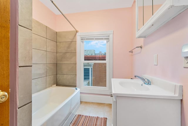 bathroom featuring tile patterned floors, vanity, and tiled shower / bath combo