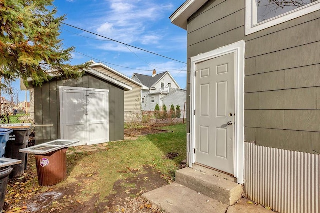 entrance to property with a yard