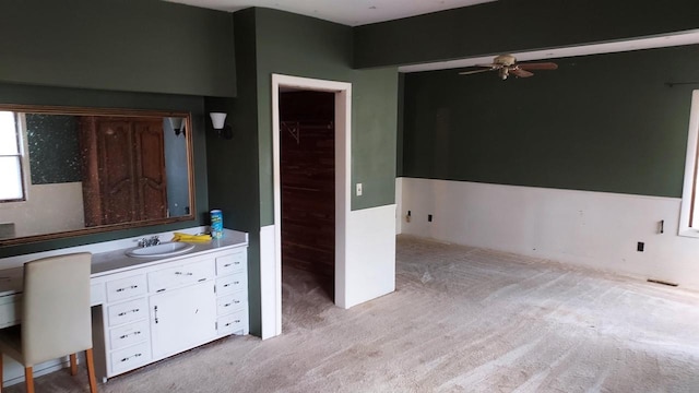 interior space with light carpet and sink