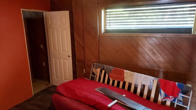 bedroom with wooden walls