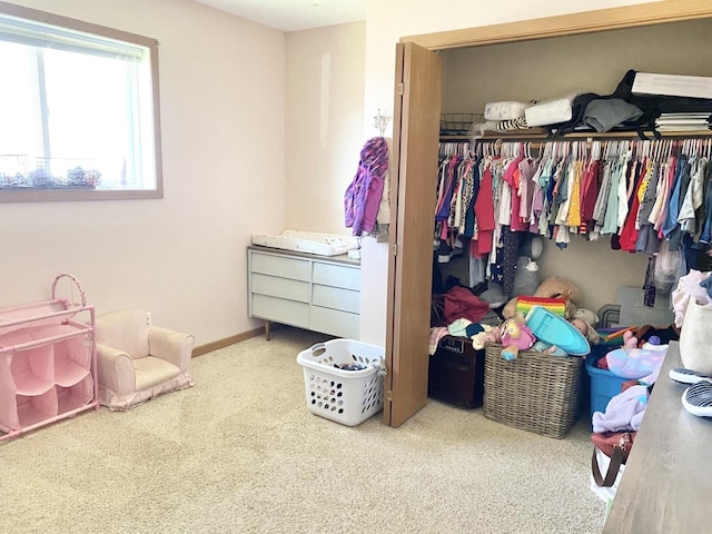 carpeted bedroom with a closet