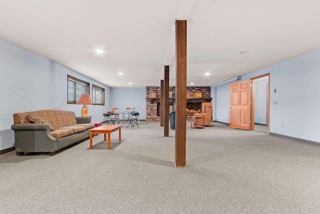 carpeted living room with a brick fireplace