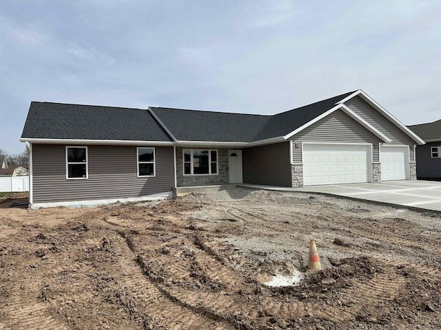 ranch-style home featuring a garage