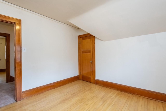 bonus room with light wood-type flooring