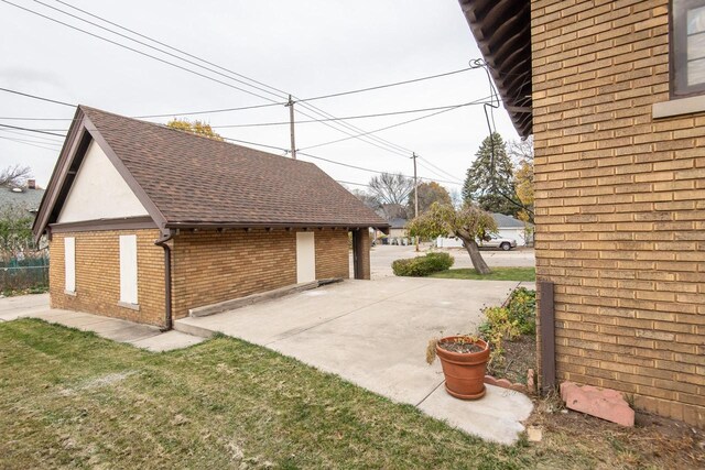 view of side of home featuring a patio area