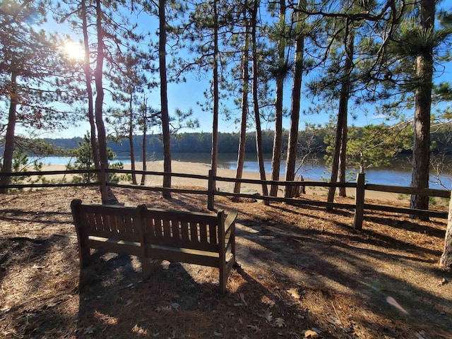 surrounding community featuring a water view