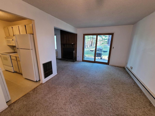 unfurnished living room with heating unit, light carpet, a textured ceiling, and a baseboard heating unit