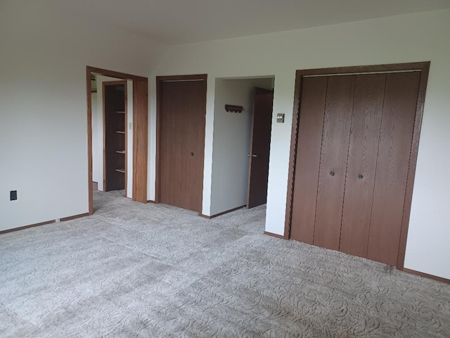 unfurnished bedroom featuring light colored carpet