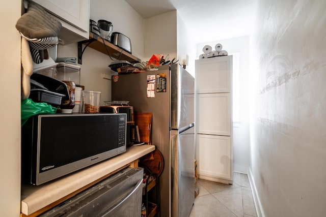 330 E Locust St, Milwaukee, WI 53212 - kitchen featuring light tile patterned floors and baseboards
