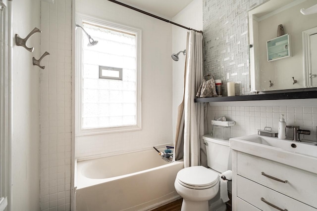 330 E Locust St, Milwaukee, WI 53212 - full bath with tile walls, shower / bath combo with shower curtain, toilet, vanity, and backsplash
