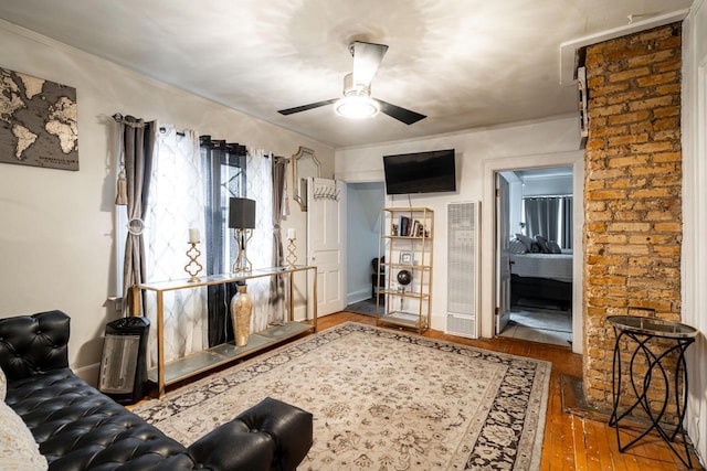330 E Locust St, Milwaukee, WI 53212 - living area with a heating unit, a ceiling fan, and hardwood / wood-style floors