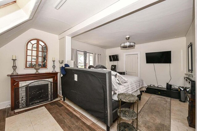 living room featuring lofted ceiling and wood-type flooring