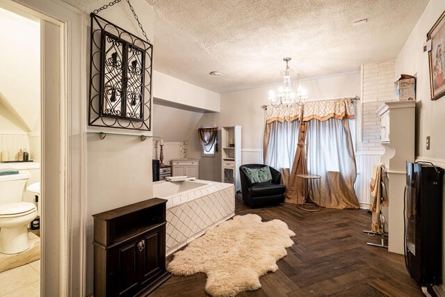 330 E Locust St, Milwaukee, WI 53212 - bedroom featuring a chandelier and a textured ceiling