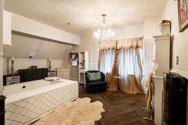 330 E Locust St, Milwaukee, WI 53212 - sitting room featuring a textured ceiling, a chandelier, and a wainscoted wall