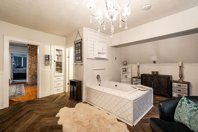 330 E Locust St, Milwaukee, WI 53212 - full bathroom featuring a chandelier, a garden tub, and a textured ceiling