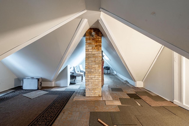 330 E Locust St, Milwaukee, WI 53212 - additional living space with decorative columns and lofted ceiling