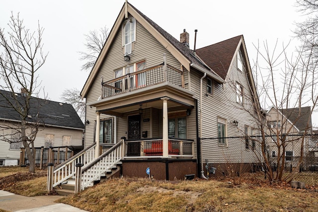 view of front of house featuring a balcony