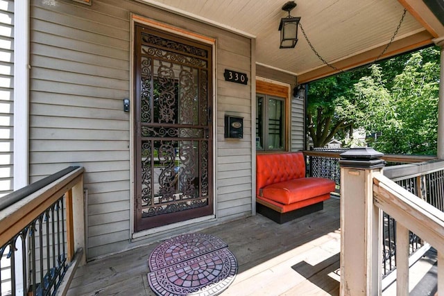 view of exterior entry featuring a porch