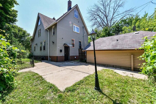 exterior space with a lawn and a patio