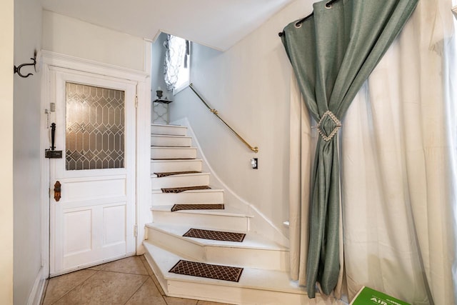 330 E Locust St, Milwaukee, WI 53212 - stairs with tile patterned floors and baseboards