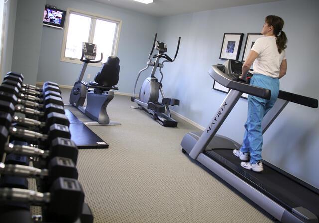 workout area featuring carpet flooring