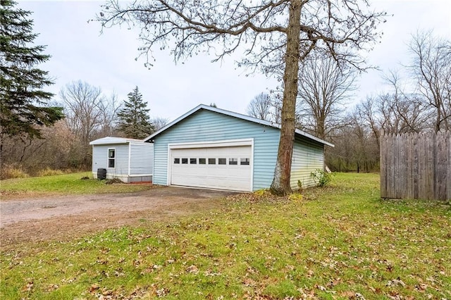 garage featuring a yard