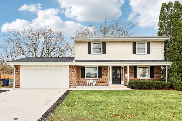 view of front property with a garage and a front lawn